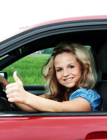 Women Driving Giving Thumbs Up